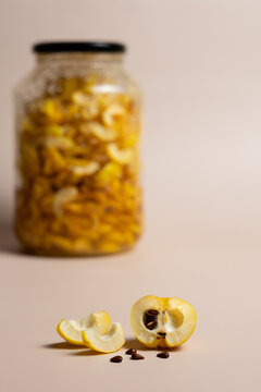 Homemade Preserved Quince in Jar and Fresh Quince with Seeds