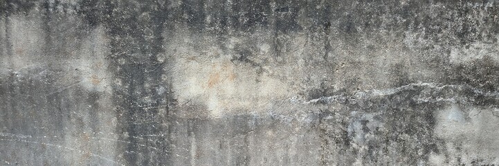 Grungy concrete wall surface showing aged texture with cracks and stains © Harry