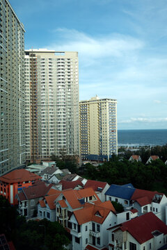 The repetitive grid of apartment building facades reveals urban density in a Vietnamese city. Vung Tau. Vietnam.