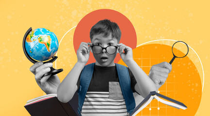 Obraz na płótnie Canvas Surprised Young Boy, Caucasian, Wearing Glasses, Studying Globe And Books At School, Engaged In Learning, Exploring Knowledge. Education Concept Focused On Academic Growth And Curiosity.