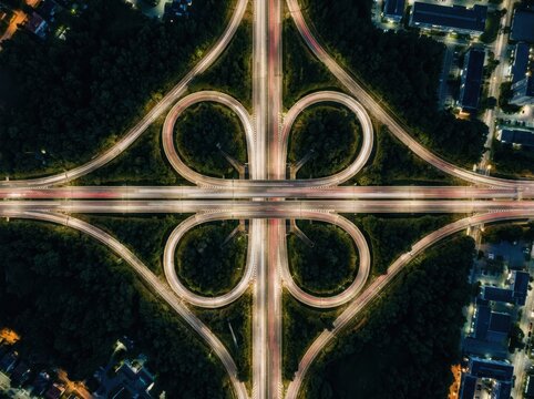 Cloverleaf Interchange Aerial View With Night Traffic Light Trails