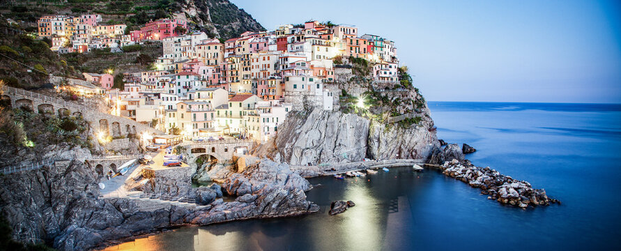 panorama view of Manarola village one of Cinque Terre at night in La Spezia, Italy