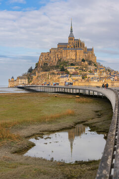 Reflection of the abbey in a tidal pond, Le Mont-Saint-Michel, Manche Department, Normandy, France