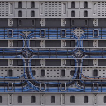Seamless image of blue, black, and grey network cables neatly arranged in a modern data center server rack, representing efficient IT infrastructure and digital connectivity.