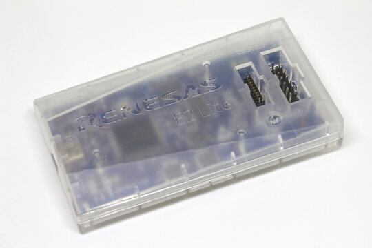 Ankara, Turkey &ndash; October 7, 2026: Renesas E2 Lite on-chip debugger and emulator for Renesas microcontrollers in its transparent plastic case on white background.