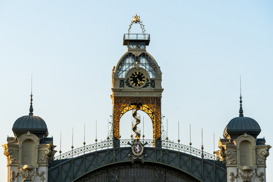 View of the ornate clock tower and architectural roof details of the historic Prague Main Railway Station in Prague, Prague, Czechia.
