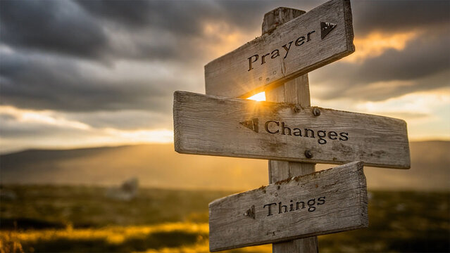 prayer changes things text on signpost during golden hour
