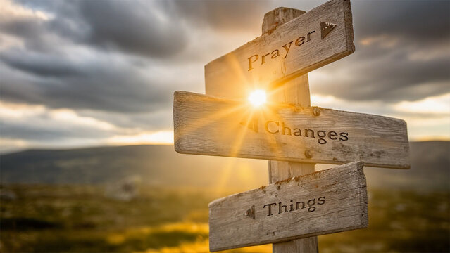 prayer changes things text on signpost during golden hour