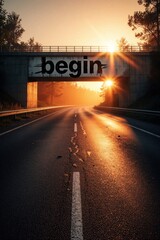 Fototapeta premium Empty asphalt road leads under concrete bridge at sunrise. Black word begin written on overpass wall. Golden sun light shines through tunnel onto highway. Concept of new start, career growth, life
