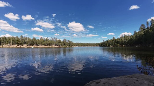 Scenic Time-Lapse of Clouds Moving Over Woods Canyon Lake, Arizona With Kayakers 
