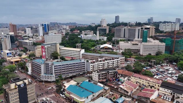 Aerial view of Kampala city skyline with dense urban buildings, busy streets, and parking lots in Kampala, Central Region, Uganda.