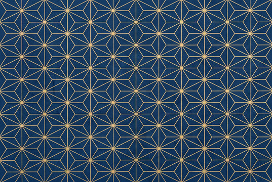 Japanese asanoha hemp leaf pattern in gold on indigo washi paper, traditional background texture