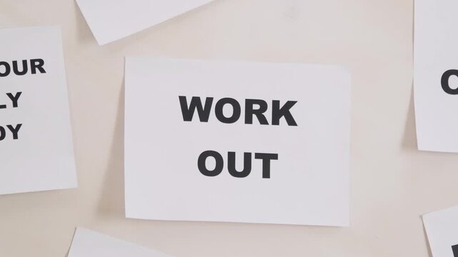 Inspiring motivational cards on a desk promoting fitness and positive affirmations.