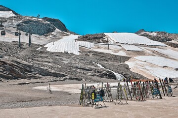 Hintertux glacier ski area in summer with snow covered by protective fleece sheets and gondola lifts, Austria © anand tripathi