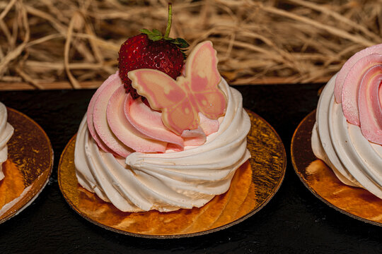 Gourmet dessert display at a luxury resort hotel for Oktoberfest. Selection of German cream cake, Maritozzo, chocolate mousse, and Tiramisu on a festive buffet table.
