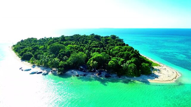 Aerial view of Sangalaki Island featuring turquoise waters, coral reefs, and sandy beaches in Berau, East Kalimantan, Indonesia.