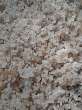 Pile of dried uncooked rice grains.
