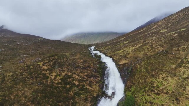 Eas a' Bhradain Waterfall from a drone, Blackhills Waterfall, Loch Ainort, A87 road, Isle of Skye, Scotland, England, United Kingdom