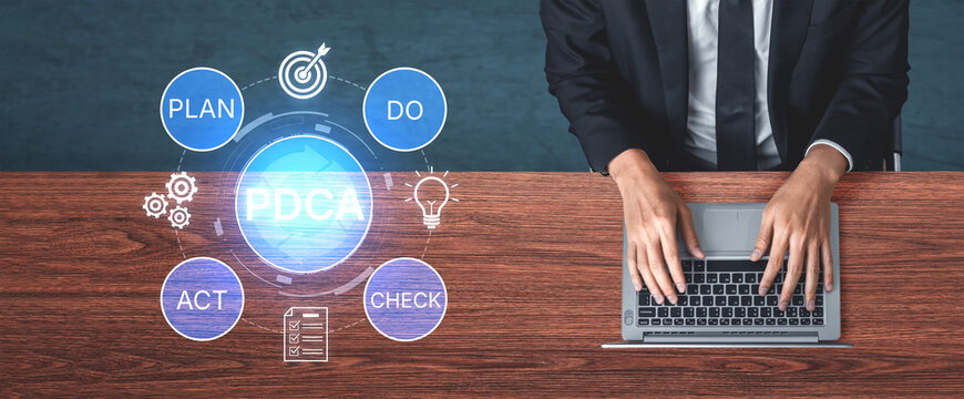 Businessman Using Laptop to Implement PDCA Cycle for Effective Management and Process Improvement in Modern Office Environment. Bitwise.
