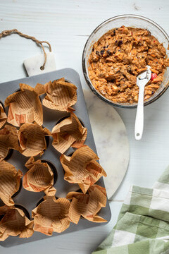 Morning glory muffin batter ready to fill a lined muffin tin.