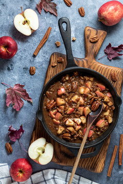 A frypan of a caramel apple butter pecan topping for French toast. 