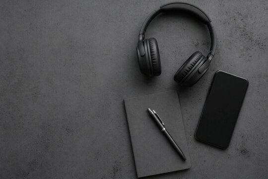 Tech gadgets flat lay with headphones and smartphone