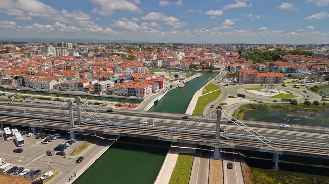Aerial View of Aveiro Canal, Red-Tiled Rooftops and Busy Bridge
