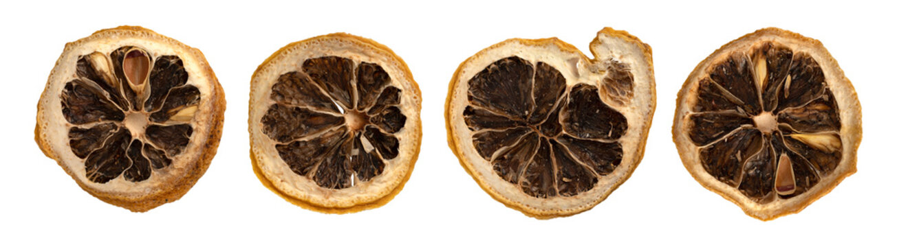 Set of dried black lemon slices isolated on transparent background. Flat lay macro winter citrus fruits with clipping path
