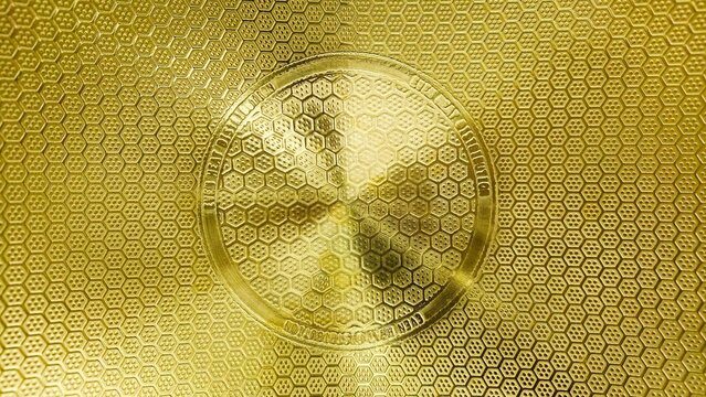 Close-up of a yellow copper pan background with a golden pattern. Decoding vintage copper cookware stamps.