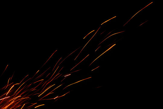 Red Orange Fire Sparks Streaks Rising Diagonally on Black Background