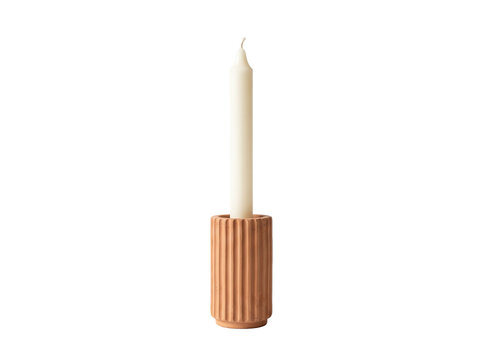 Terracotta fluted candle holder with white taper candle isolated on