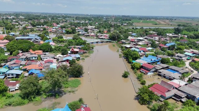 October 9, 2026, Sena District, Ayutthaya. Rainwater flowing from the north and heavy rainfall caused small rivers to overflow, flooding riverside homes in rural areas of Ayutthaya, Thailand.