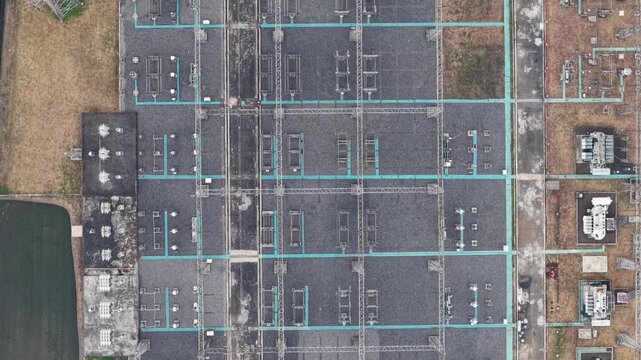 Top down drone shot of Malang high voltage substation revealing grid layout and transformers