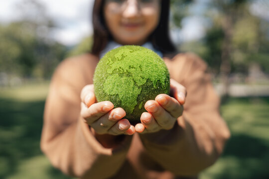 World Environment Day, Earth globe in woman hand for protect and save planet, Environmental care for sustainable. Green business and ESG concept to responsibility and conservation