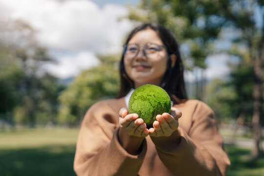 World Environment Day, Earth globe in woman hand for protect and save planet, Environmental care for sustainable. Green business and ESG concept to responsibility and conservation