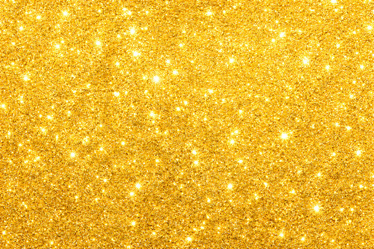 Shimmering gold glitter background with sparkling light effects for