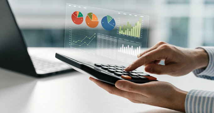 Accountant using calculator with floating financial analytics pie chart and bar graph dashboard. Hands calculating tax report using electronic calculator with modern digital data chart overlay