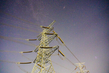 Obraz premium Power pylon starry sky electric tower