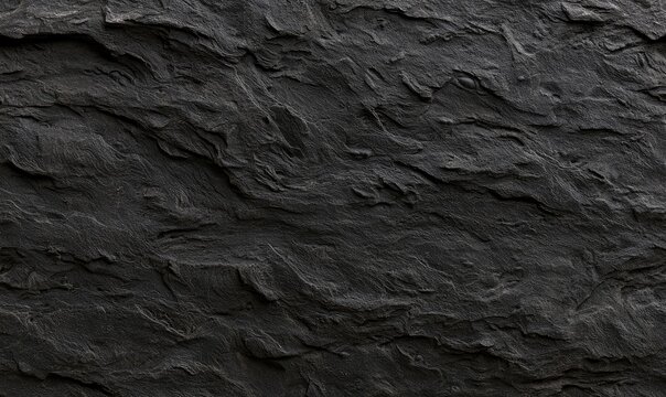 Dark, textured, rugged stone surface with layered, rough, wavy patterns