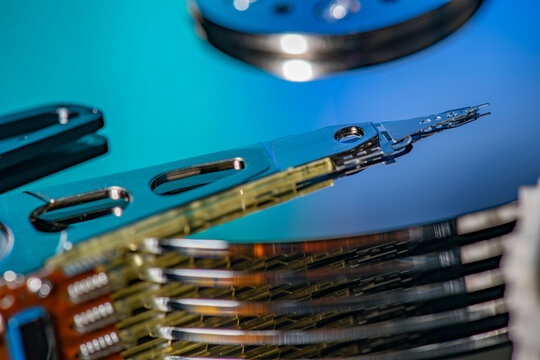 Hard drive reading head moving over disk platter