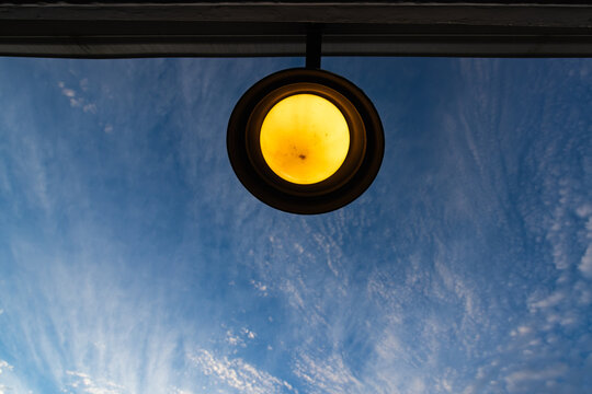 graphic image of overhead front door lamp and sunrise clouds
