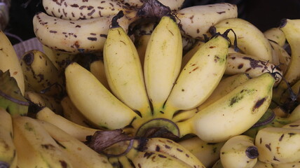 Fresh Ripe Yellow Bananas with Natural Brown Spots, Close-Up Tropical Fruit Background  © Fresh Foods