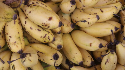 Fresh Ripe Yellow Bananas with Natural Brown Spots, Close-Up Tropical Fruit Background  © Fresh Foods