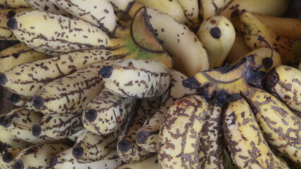 Fresh Ripe Yellow Bananas with Natural Brown Spots, Close-Up Tropical Fruit Background  © Fresh Foods