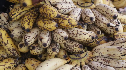 Fresh Ripe Yellow Bananas with Natural Brown Spots, Close-Up Tropical Fruit Background  © Fresh Foods