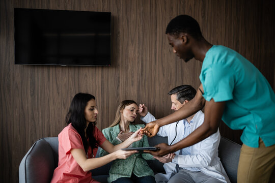 Medical team assisting a patient experiencing a health emergency