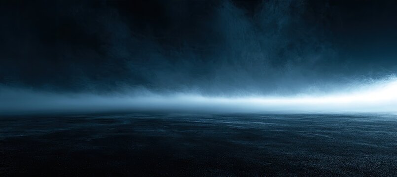 Dark, atmospheric, ground-level view of swirling blue mist against a bright horizon