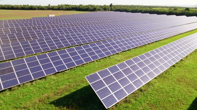 Drone perspective of solar panel field with precise parallel lines. Clean power scene ideal for utility, environmental responsibility, and energy transition visuals