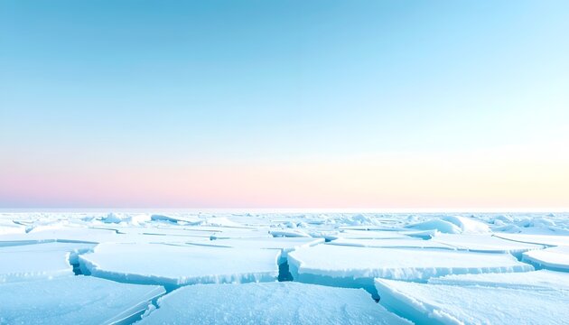 Arctic winter landscape featuring cracked ice floes on frozen ocean under sunset sky with copy space for text