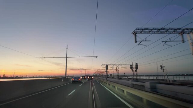 Evening traffic moving across a bridge